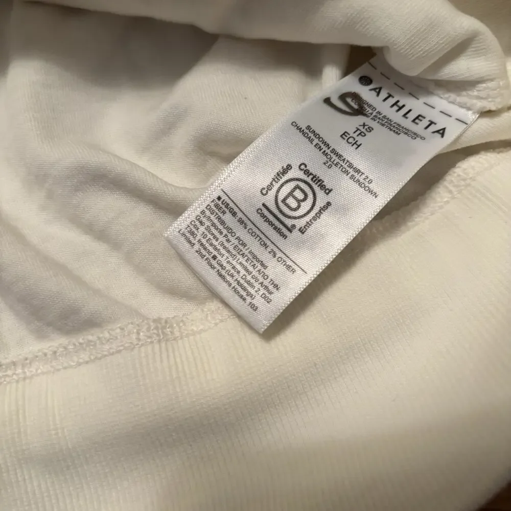 NWT ATHLETA Women’s Sundown Sweatshirt 2.0 White XS Stain New Workout Top